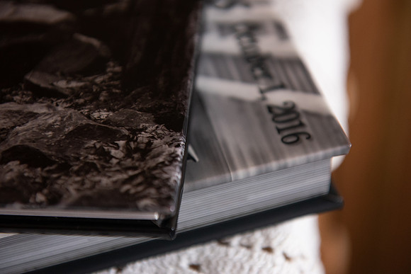 Book stacked on Album